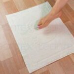 tapete de baño beige pies